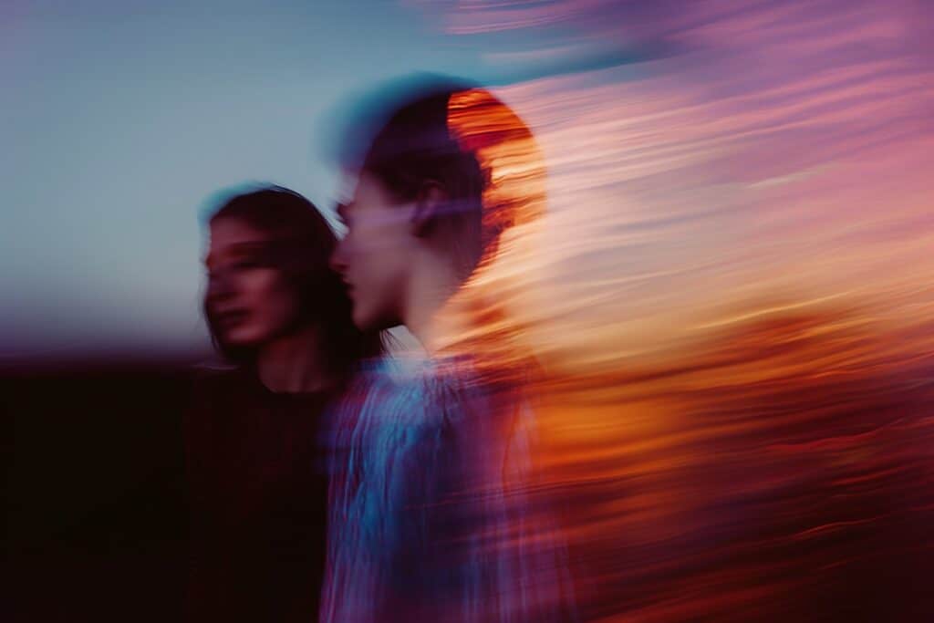 Professional woman running with a tablet, symbolizing the speed and reach of AI education worldwide.