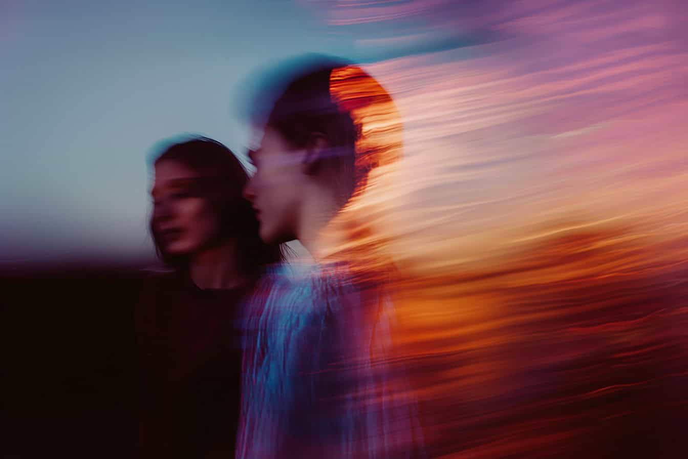 Professional woman running with a tablet, symbolizing the speed and reach of AI education worldwide.